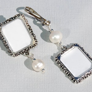 A lapel pin and a wedding bouquet charm set for the bride and groom. Both have a small picture frame in antique silver tones and a freshwater pearl. You can add the photos yourself or chose for me to do them. Other beads & colors available- just ask.