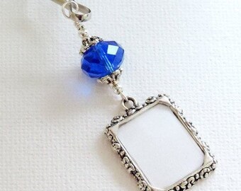 Wedding bouquet charm featuring  a cobalt blue crystal and small picture frame. Memorial photo charm. Something blue.