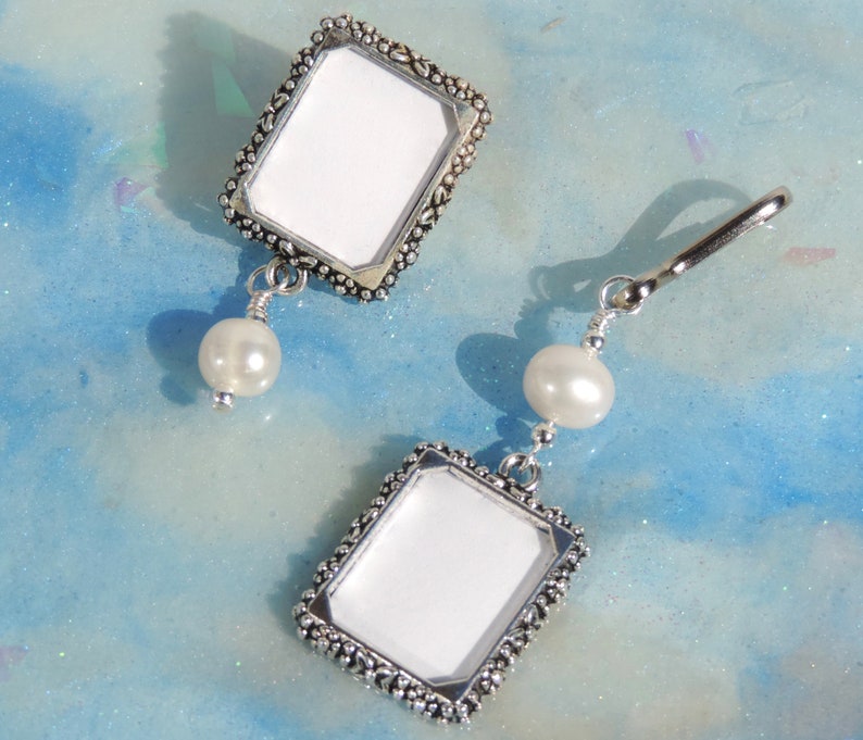 A lapel pin and a wedding bouquet charm set for the bride and groom. Both have a small picture frame in antique silver tones and a freshwater pearl. You can add the photos yourself or chose for me to do them. Other beads & colors available- just ask.