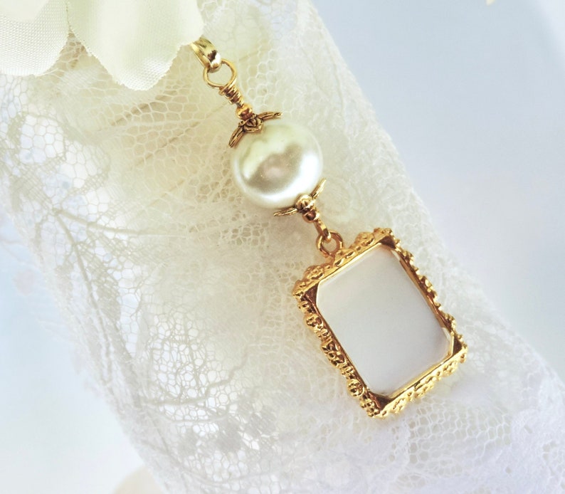 A lovely wedding bouquet photo charm in golden tones featuring an ivory, white, blue or pink shell pearl bead and small picture frame. 
What a thoughtful bridal shower gift. Just add your picture of a loved one, or let me do the photo too :)