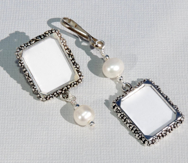 A lapel pin and a wedding bouquet charm set for the bride and groom. Both have a small picture frame in antique silver tones and a freshwater pearl. You can add the photos yourself or chose for me to do them. Other beads & colors available- just ask.