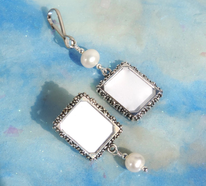 A lapel pin and a wedding bouquet charm set for the bride and groom. Both have a small picture frame in antique silver tones and a freshwater pearl. You can add the photos yourself or chose for me to do them. Other beads & colors available- just ask.