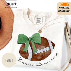 Comfort Colors® Cute Football Mom Shirt, Custom Mascot Bow Shirt, Coquette Bows School Spirit Tshirt, Cheer Mascot Tee, Football Team
