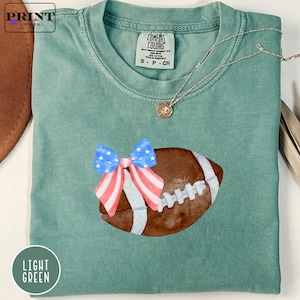 Comfort Colors® Cute Football Mom Shirt, American flag shirt women, Coquette Bows School Spirit Tshirt, Cheer Mascot Tee, Football Team