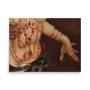 May include: A print of a painting depicting a person adorned with ornate jewelry. The jewelry includes a jeweled bodice, bracelets, and rings, all featuring red gemstones. The person's arm is outstretched, and the background is a dark brown.