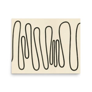 May include: A rectangular wall art print featuring a continuous, hand-drawn black line that loops and curves across a solid, off-white background. The line creates a series of vertical, elongated, and irregular shapes that span the entire width.