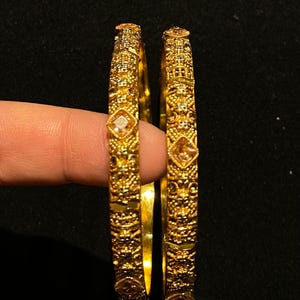 Pair of Exquisite Gold-Plated Bangles with Stone Embellishments