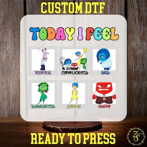 May include: A white wooden sign featuring the phrase "TODAY I FEEL" in vibrant colours. Below are cartoon characters depicting emotions: Fearful, Complicated, Sad, Disgusted, Joyous, and Angry. The sign also includes the text "CUSTOM DTF" and "READY TO PRESS".