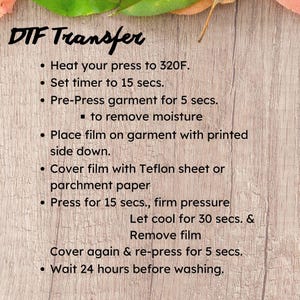 May include: DTF Transfer instructions are displayed on a wooden surface. The steps include heating the press to 160&deg;C, setting the timer to 15 seconds, and pre-pressing the garment for 5 seconds. The instructions continue with covering the film and pressing again.
