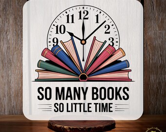 May include: A square, white clock with a clock face and a design of open books. The clock face shows the time as 12:07. The text "SO MANY BOOKS SO LITTLE TIME" is below the books. The words "CUSTOM DTF" and "READY TO PRESS" are at the top and bottom.