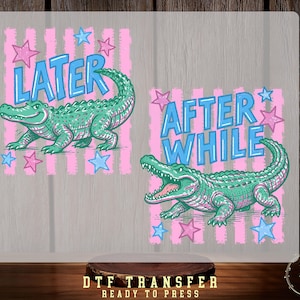 May include: Two graphic designs featuring cartoon alligators with the phrases "LATER" and "AFTER WHILE" in blue text. The alligators are green with pink accents, set against pink and white striped backgrounds with blue and pink stars.