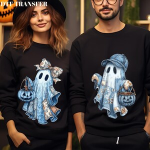 May include: Black sweatshirts featuring a light blue ghost design holding a pumpkin-shaped basket. The ghost has a patchwork design with a bow and a baseball cap. The text "DTF TRANSFER" is at the top.