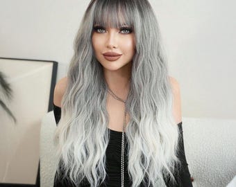 May include: A long, wavy, silver and white wig with bangs. The wig is styled in a loose, flowing wave and has a dark root color.