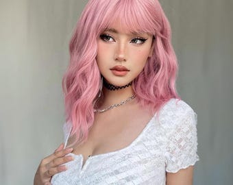 May include: A woman with pink wavy hair and a white lace top. She is wearing a black choker necklace and a silver chain necklace.