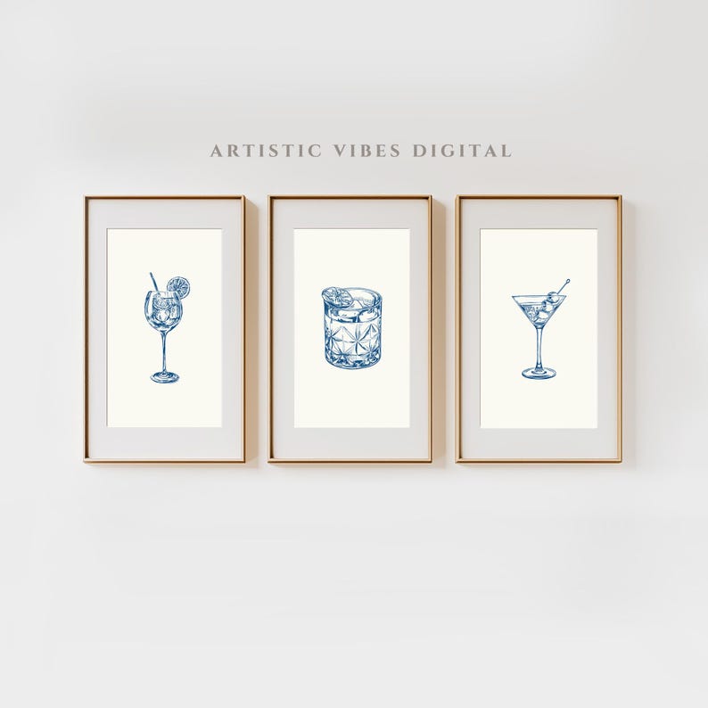 May include: Three printable wall art prints featuring blue line drawings of different cocktail glasses. The first print shows a glass with a straw and a lemon wedge. The second print shows a lowball glass with ice cubes. The third print shows a martini glass with an olive.