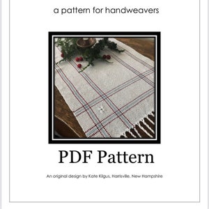 May include: A white table runner with a woven pattern of red and blue stripes. The runner is on a wooden table with a candle and greenery. The text "Lacy Windows Table Runner" and "PDF Pattern" is visible on the image.