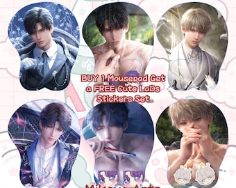 May include: Six colorful mousepads featuring anime-style illustrations of men. Each mousepad has a different image of a man with a different hairstyle and expression. The text "BUY 1 Mousepad Get a FREE Cute LaDs Stickers Set" is in the center of the image. The text "Mikoya Arts" appears at the top and bottom of the image.