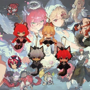 May include: Collection of anime-style character keychains. The keychains feature various characters with animal-like features, such as fox and wolf ears. The characters have detailed designs and vibrant colors, with gold-colored chain attachments.