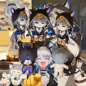 May include: A collection of plush dolls featuring a character with gray hair, blue eyes, and a black hooded outfit with cat ears. The dolls are in various poses, some with winking expressions. The word "BUY" is visible on one of the characters.