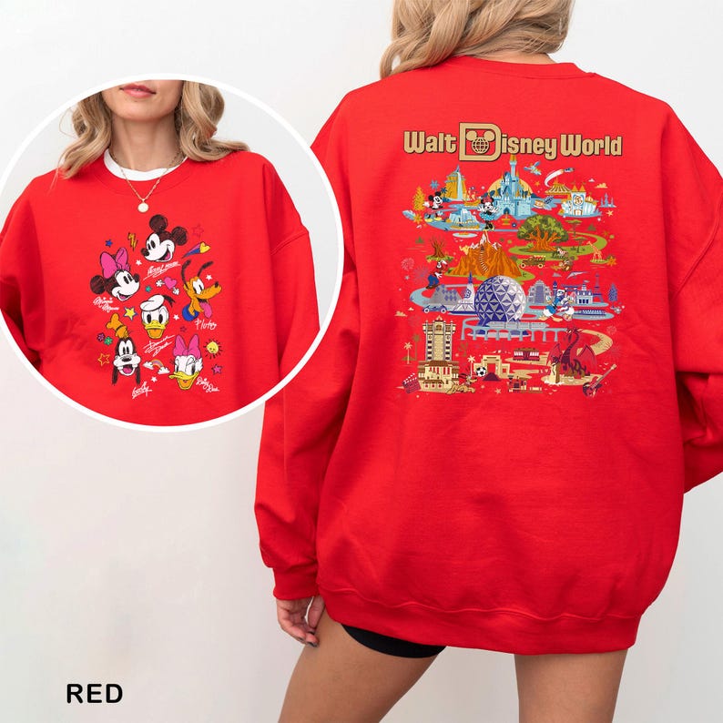 May include: A red sweatshirt featuring Disney characters on the front and a Walt Disney World graphic on the back. The front displays Mickey, Minnie, Donald, Daisy, Goofy, and Pluto. The back showcases park attractions and the text "Walt Disney World."