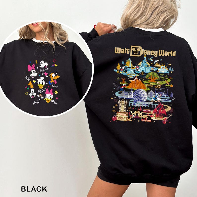 May include: Black sweatshirt with a white collar featuring Disney characters on the front and a colorful Walt Disney World graphic on the back. The front design includes Mickey, Minnie, Donald, Daisy, and Goofy. The text "BLACK" is at the bottom.