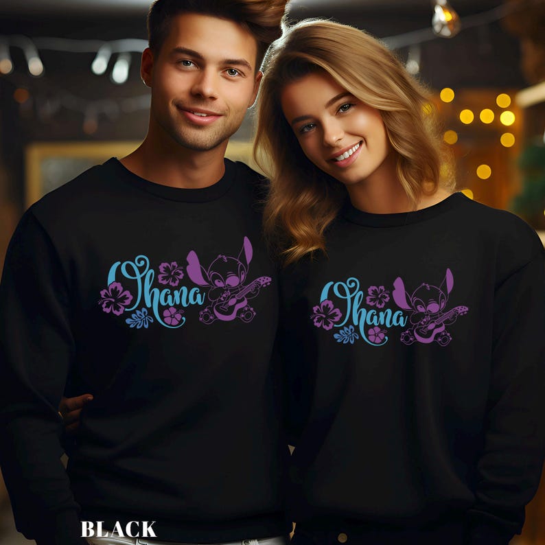 May include: Black sweatshirts with the word "Ohana" in blue and purple script, accompanied by a cartoon character playing a guitar. The sweatshirts are worn by two people. The word "BLACK" is printed at the bottom.