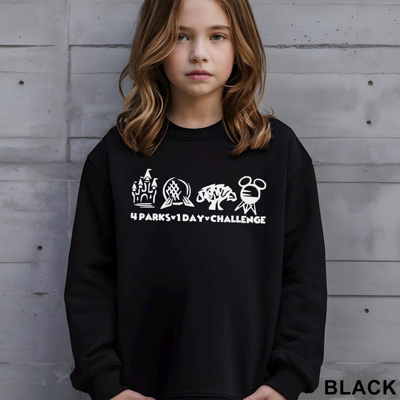 May include: Black sweatshirt with a white graphic featuring a castle, globe, tree, and Mickey Mouse head, with the text "4 PARKS 1 DAY CHALLENGE". The word "BLACK" is printed at the bottom right.