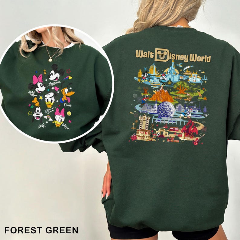 May include: Forest green sweatshirt featuring a circular graphic of Disney characters including Mickey Mouse, Minnie Mouse, Donald Duck, and Daisy Duck. The back of the sweatshirt displays a colorful illustration of Walt Disney World with the text "Walt Disney World".