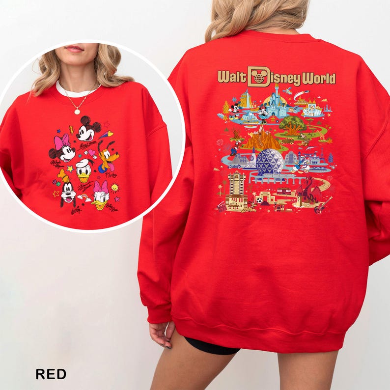 May include: A red sweatshirt featuring Disney characters on the front and a Walt Disney World graphic on the back. The front displays Mickey, Minnie, Donald, Daisy, Goofy, and Pluto. The back shows a colorful map of the park.