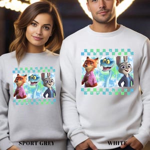 May include: Sport grey and white sweatshirts featuring a colorful graphic of three cartoon characters. The characters are a fox, a snake, and a rabbit. The sweatshirts have a checkered pattern at the top and the bottom. The text "SPORT GREY" and "WHITE" are at the bottom.