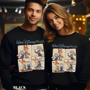 May include: Black sweatshirts with a cartoon design of Zootopia characters. The sweatshirts have the text "Walt Disney World" in blue script above the cartoon images. The cartoon images show Nick Wilde and Judy Hopps in various poses. The word "BLACK" is at the bottom.