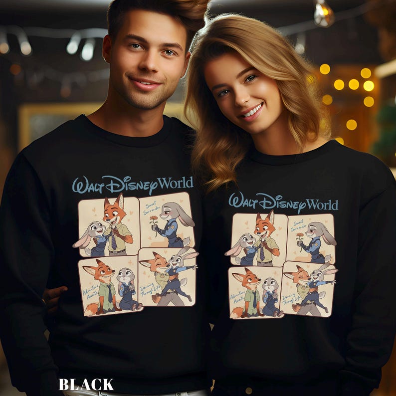 May include: Black sweatshirts with a cartoon design of Zootopia characters. The sweatshirts have the text "Walt Disney World" in blue script above the cartoon images. The cartoon images show Nick Wilde and Judy Hopps in various poses. The word "BLACK" is at the bottom.