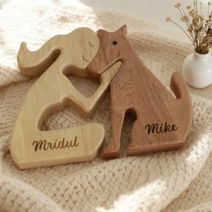 May include: A white ceramic mug with a black handle and the text "But First, Coffee" in a bold, black font. The mug is set against a blurred background, suggesting a cozy setting. The mug appears to be approximately 4 inches tall.