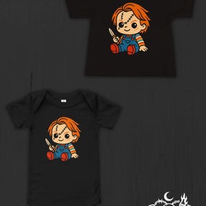 May include: A black short-sleeved t-shirt and a black short-sleeved bodysuit, both featuring a graphic of a cartoon character with orange hair, stitches on the face, blue overalls, and a knife. The logo Nocturnal Nursery Co is in the corner.