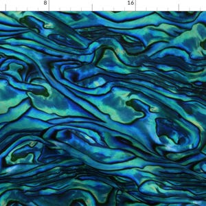 May include: A close-up of a blue and green abalone shell with a swirling pattern. The shell has a iridescent sheen and a smooth texture.