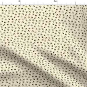 May include: A white fabric with a repeating pattern of small brown floral designs. The fabric has a subtle texture and a slightly off-white background.
