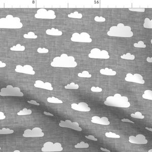 May include: A gray fabric with a white cloud pattern. The clouds are scattered randomly across the fabric.