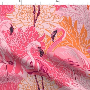 May include: A pink and orange floral pattern with pink flamingos. The pattern is a repeating design and features stylised flowers and birds.