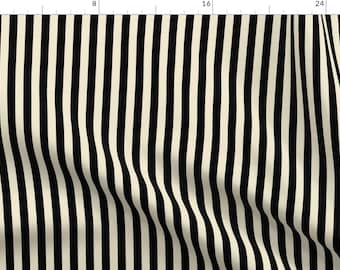 May include: Cream and black striped fabric. The fabric features vertical stripes of alternating colors. The stripes are approximately 1 inch wide. The fabric has a slight wave pattern, adding texture to the design.