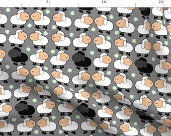 May include: A repeating pattern of white sheep with black eyes and noses on a gray background. One black sheep is included in the pattern. Small green flowers are scattered throughout the pattern.