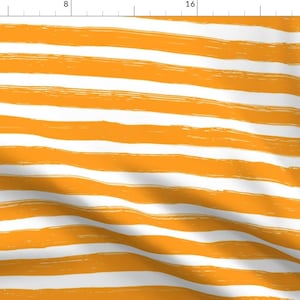 May include: White fabric with wide, horizontal stripes in a bright orange color. The stripes are painted on, giving a textured look.