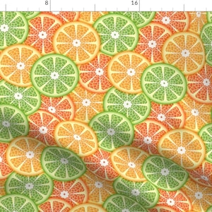May include: A seamless pattern of orange, lime, and grapefruit slices. The citrus fruit slices are arranged in a repeating pattern, creating a vibrant and colourful design.