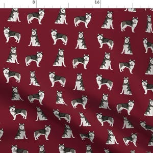 May include: A repeating pattern of Siberian Husky dogs on a burgundy background. The dogs are in various poses, including standing, sitting, and running. The pattern is perfect for fabric, wallpaper, or wrapping paper.