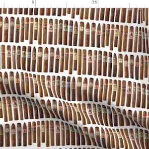 May include: A white background with a repeating pattern of brown cigars with different colored bands. The cigars are arranged in rows and columns.
