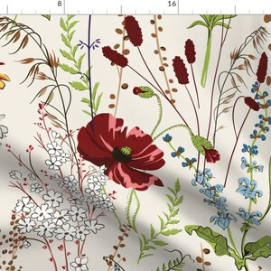 May include: A fabric print featuring a botanical pattern on a cream background. The design includes red poppies, yellow daisies, white wildflowers, blue spikes, and various green grasses and brown seed heads, all illustrated in a detailed style.