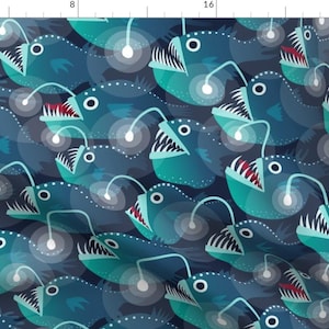 May include: A seamless pattern featuring a repeating design of blue and teal anglerfish with glowing lures. The fish are set against a dark blue background.
