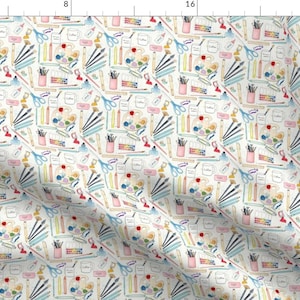 May include: A white background with a repeating pattern of art supplies. The pattern includes paintbrushes, pencils, scissors, paint palettes, and jars of paint. The colours in the pattern are blue, pink, yellow, green, red, and brown.