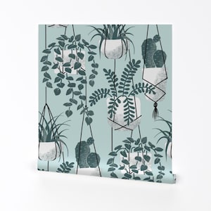 Peut inclure: Un motif sans couture représentant des plantes suspendues de différentes formes et tailles. Les plantes sont représentées dans des tons de vert et de blanc sur un fond bleu clair.