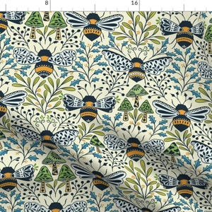 May include: A seamless pattern featuring stylized bees, mushrooms, and foliage in shades of green, blue, yellow, and black on a cream background.