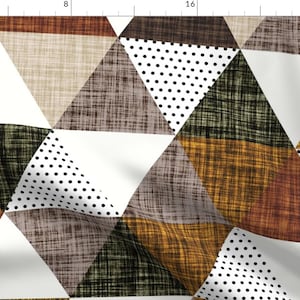 May include: A geometric pattern featuring a variety of triangles in shades of brown, beige, white, black, and green. The triangles are arranged in a repeating pattern, creating a modern and stylish design.